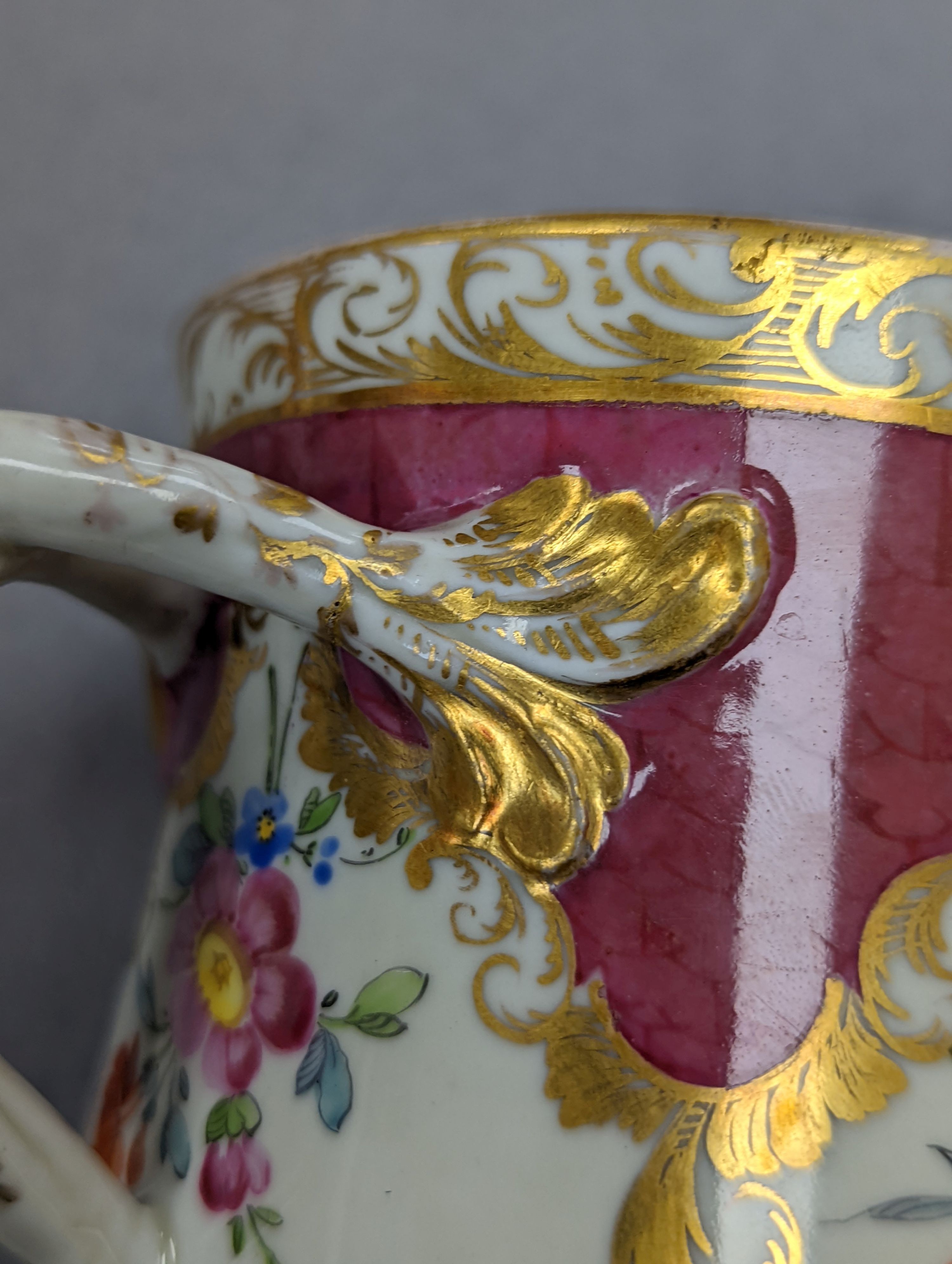 An 18th century Mennecy porcelain cup and cover, a Meissen style cup and cover, an English porcelain floral encrusted double inkwell and cover and a similar jar and cover